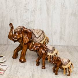 Souvenir Caramel elephant in a golden blanket with laces